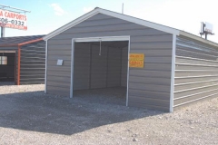 Enclosed Boxed Eave Carport with Roll-Up Door